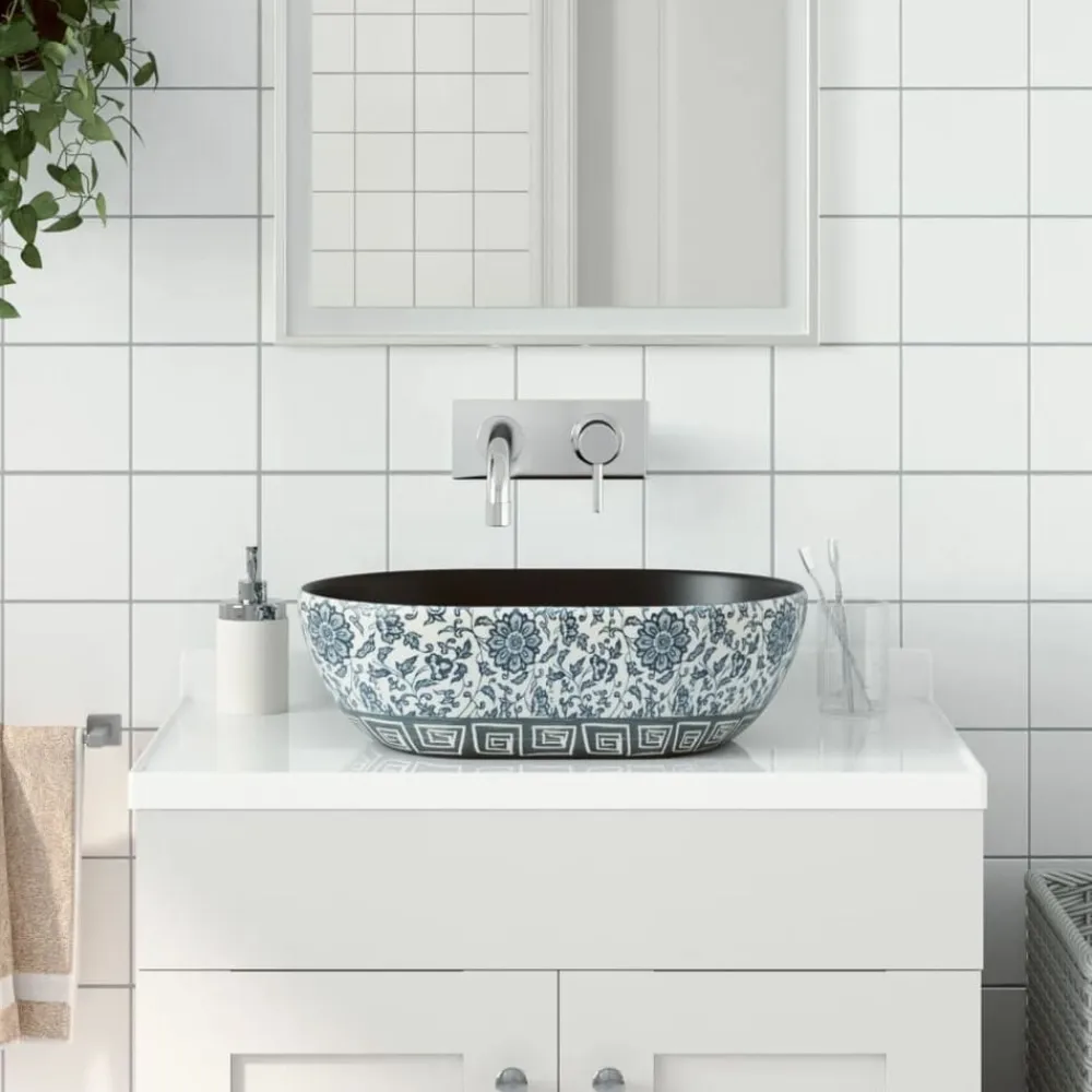 vidaXL Lavabo sobre encimera ovalado cerámica 47x33x13 cm Negro y azul