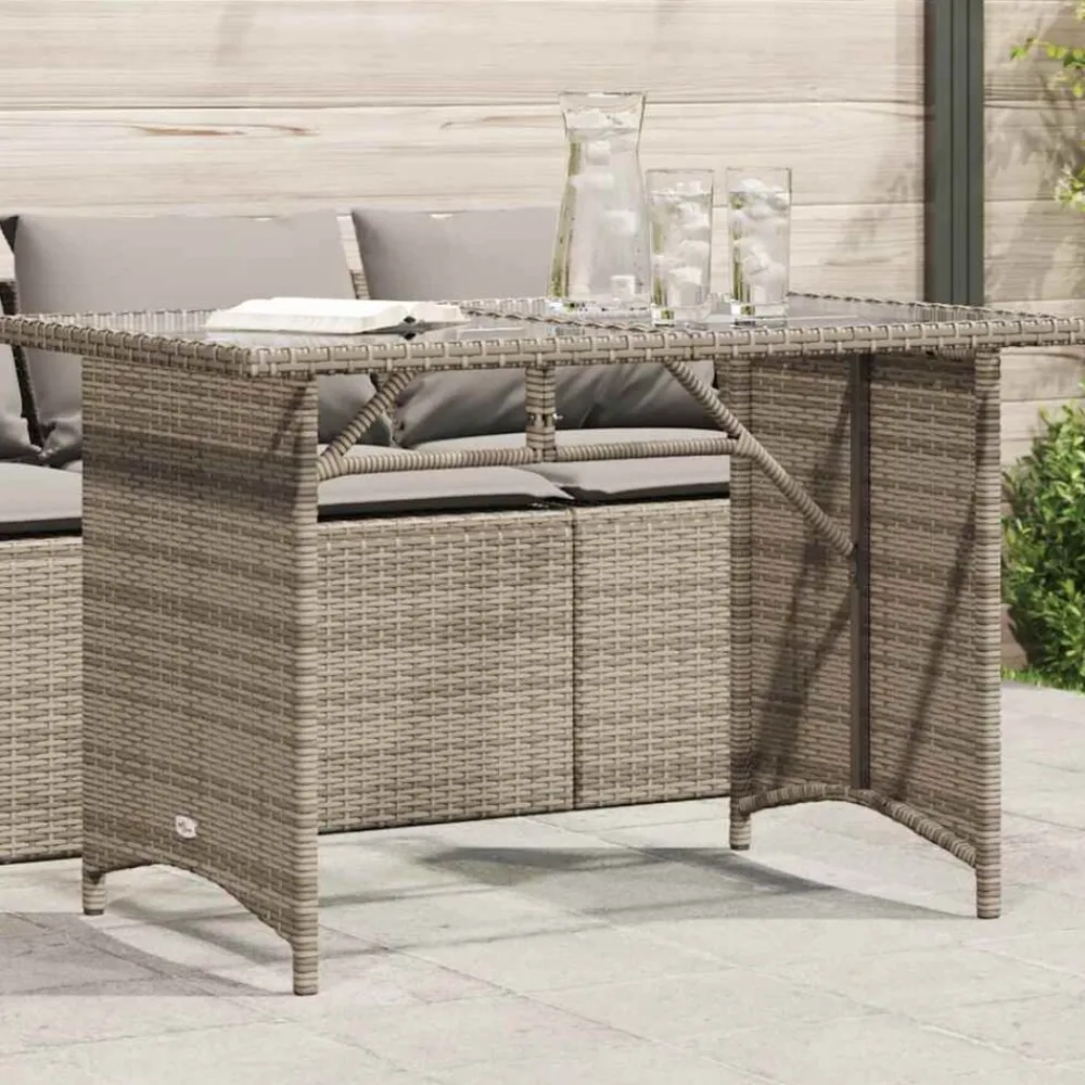 vidaXL Mesa de jardín superficie de vidrio ratán PE 110x68x70 cm Gris Hot